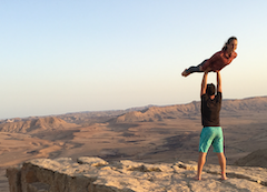Rob Matzkin doing acro yoga in a canyon